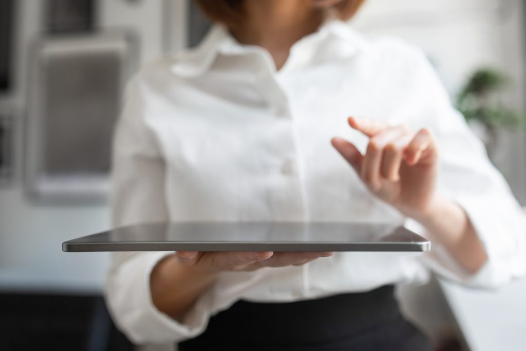 Artificial Intelligence System. Businesswoman Holding Digital Tablet And Pointing Finger Or Pressing Invisible Button - Contabilidade em Lages - SC | Fibonacci Contabilidade